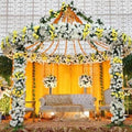 Decorative canopy with flowers and candles on a white background