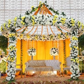 Decorative canopy with flowers and candles on a white background